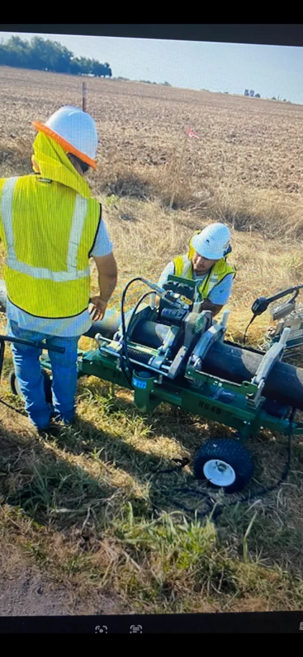 Sure Ground field inspectors on site during a waterline and utility construction project